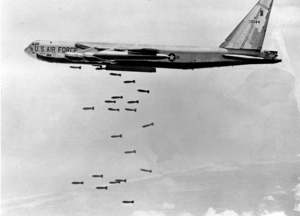 A U.S. Air Force B-52 delivers a bomb load of more than 38,000 pounds against Viet Cong strongholds in South Vietnam in March 1966 during the Vietnam War.