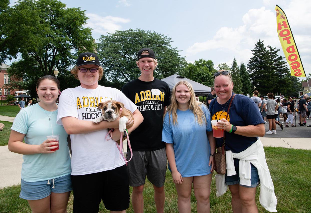 Lacey Gray, at left; Aiden Taylor, a new Adrian College student and Daisy Bear (dog); are pictured with Ian Kramp, new AC student; Isabelle Taylor (sister) and Cheryl Taylor, new AC mom; during "Sneak Peek Day" at Adrian College, held Friday, July 12, 2024.