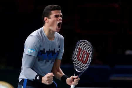 Milos Raonic of Canada celebrates defeating Tomas Berdych of the Czech Republic in his men's singles semifinal tennis match at the Paris Masters tennis tournament at the Bercy sports hall in Paris, November 1, 2014. REUTERS/Benoit Tessier