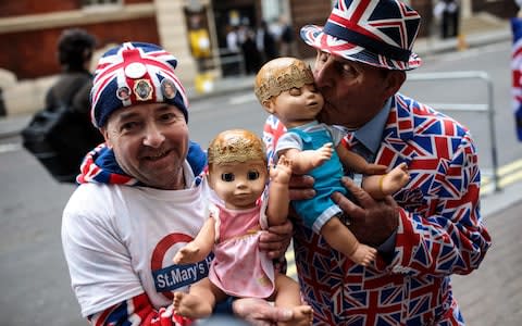 Royal fans John Loughrey (left) and Terry Hutt (right) pose with baby dolls outside the Lindo Wing of St Mary's Hospital ahead of the birth of the Duke and Duchess of Cambridge's third child on April 23, 2018 in London - Credit: Jack Taylor/Getty