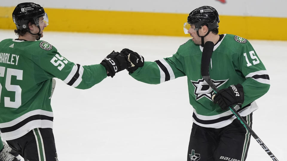 Dallas Stars center Craig Smith (15) celebrates his goal with teammate Dallas Stars defenseman Thomas Harley during the first period an NHL hockey game against the Los Angeles Kings in Dallas, Saturday, March 16, 2024. (AP Photo/LM Otero)