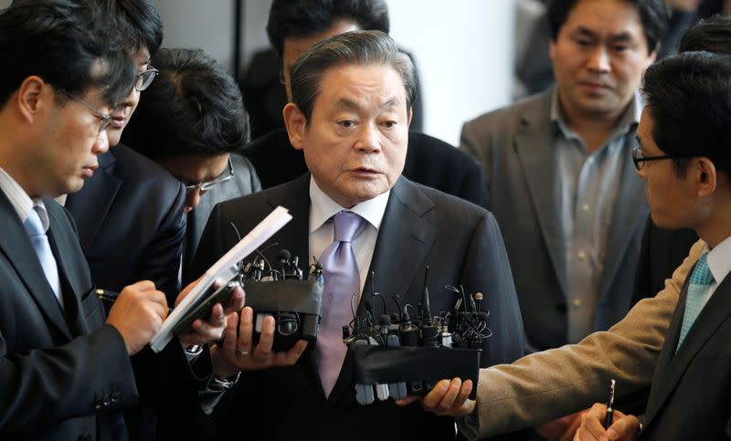 FILE PHOTO: Samsung Electronics chairman Lee Kun-hee answers reporters' questions upon his arrival at the company's headquarters in Seoul