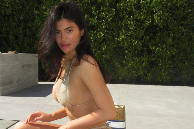 Kylie Jenner Supports Sister Khloé Kardashian by Modeling Teensy Metallic  Good American Bikini