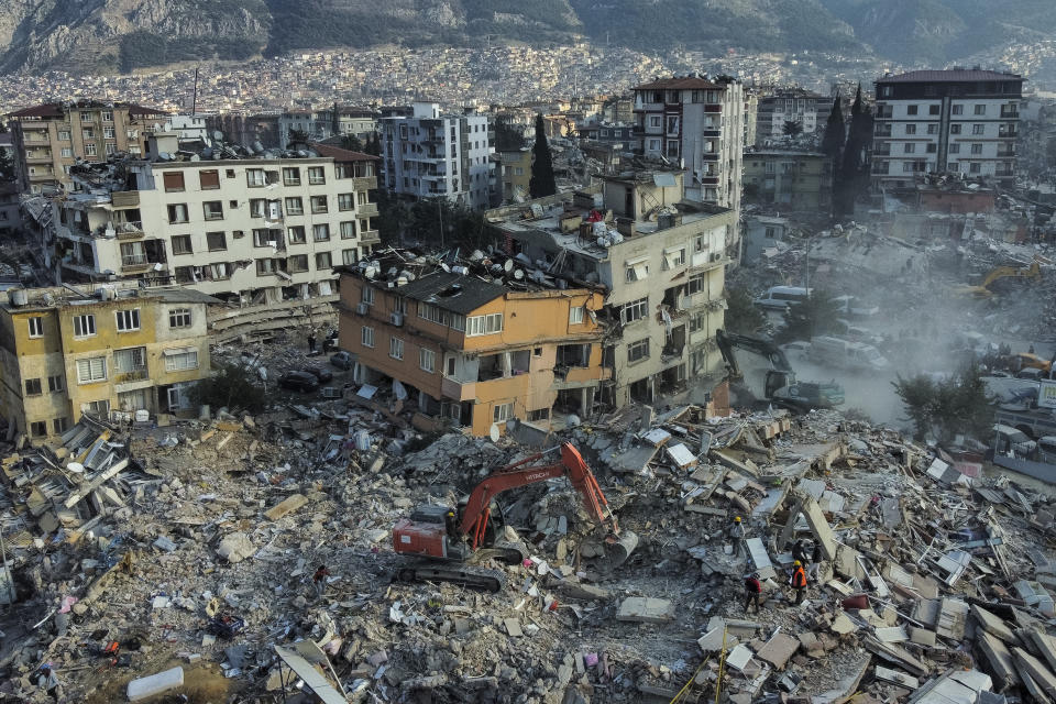 An aerial view of collapsed buildings in Antakya, southeastern Turkey, Saturday, Feb. 11, 2023. Rescue teams using thermal cameras to locate signs of life are continuing to pull survivors out of mounds of rubble, five days after a major earthquake struck a sprawling border region of Turkey and Syria. (AP Photo/Bernat Armangue)
