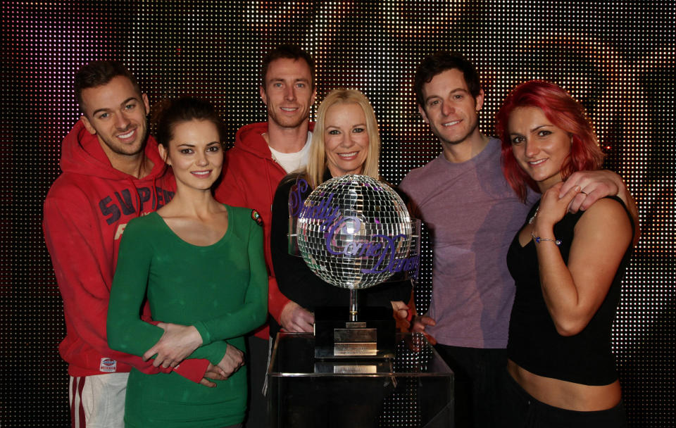 EMBARGOED UNTIL 0001 SATURDAY 18 DECEMBER. The finalists on the show (left to right) Artem Chigvintsev with dancing partner Kara Tointon, Pamela Stephenson with James Jordan and Matt Baker with Aliona Vilani posing with the winner's Trophy, during rehearsals for Strictly Come Dancing, at BBC Television Centre in west London.  