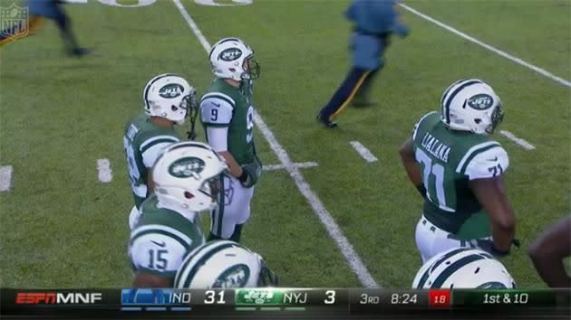 Jets players watch on as more security guards chase the drunk fans. Pic: NFL