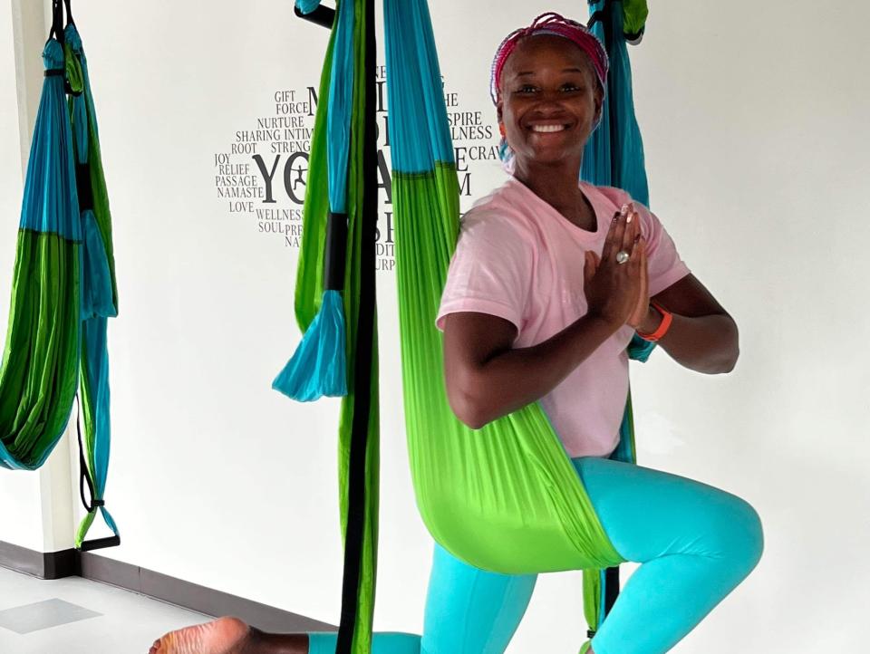 Acasia Olson doing aerial silks yoga