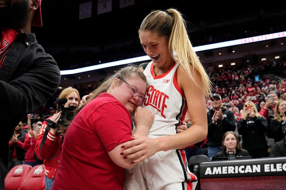 Ohio State guard Jacy Sheldon hugs her sister, Emmy, following the Buckeyes' 100-92 win over Iowa in January.
