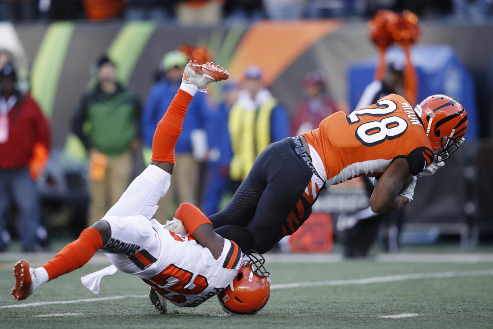 <p>Joe Mixon #28 of the Cincinnati Bengals runs over Jabrill Peppers #22 of the Cleveland Browns in the second half of a game at Paul Brown Stadium on November 26, 2017 in Cincinnati, Ohio. The Bengals won 30-16. (Photo by Joe Robbins/Getty Images) </p>