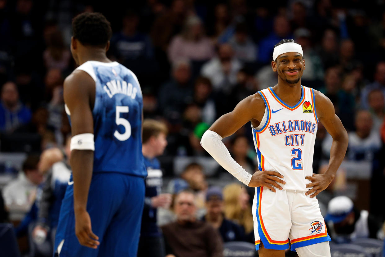 MINNEAPOLIS, MINNESOTA - JANUARY 20: Shai Gilgeous-Alexander #2 of the Oklahoma City Thunder reacts to Anthony Edwards #5 of the Minnesota Timberwolves in the third quarter at Target Center on January 20, 2024 in Minneapolis, Minnesota. The Thunder defeated the Timberwolves 102-97. NOTE TO USER: User expressly acknowledges and agrees that, by downloading and or using this photograph, User is consenting to the terms and conditions of the Getty Images License Agreement. (Photo by David Berding/Getty Images)