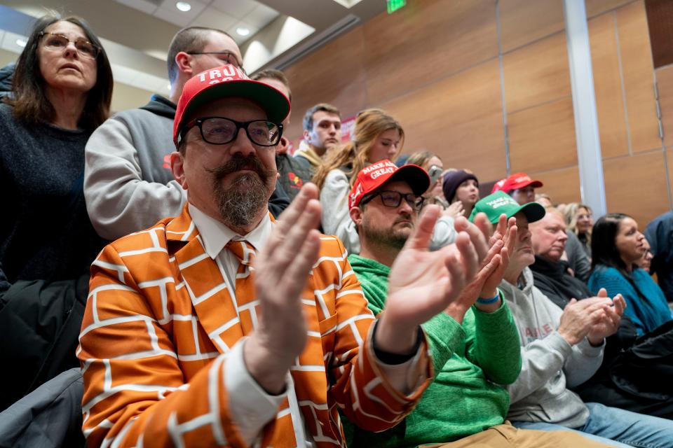 Supporters of former President Donald Trump applaud on Sunday, Jan. 14, 2024, during a Trump campaign event at Simpson College in Indianola ahead of the Iowa Caucuses.