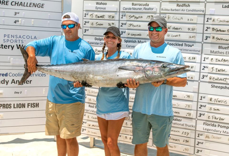 Angler Jenny Barnett gets help with her 78.24 pound Wahoo during last year's Pensacola Bud Light Fishing Rodeo.