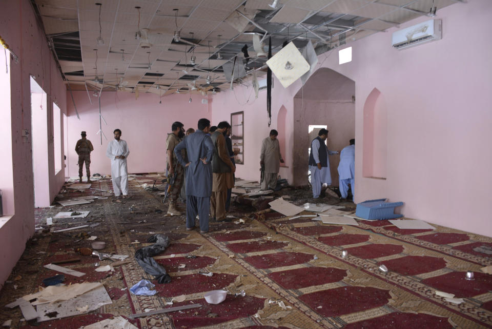 Pakistani officials examine a mosque following a bomb blast in Quetta, Pakistan, Friday, May 24, 2019. (AP Photo/Arshad Butt)