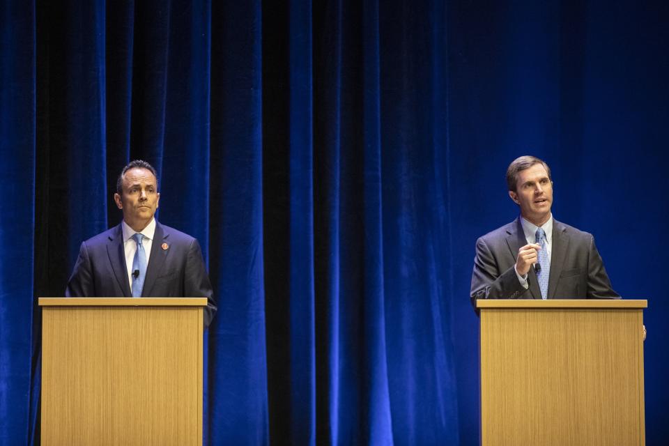 FILE - In this Tuesday, Oct. 15, 2019 file photo, Republican Gov. Matt Bevin, left, and Democratic Attorney General Andy Beshear participate in a debate, in Lexington, Ky. Kentucky's political grudge match between Republican Gov. Matt Bevin and Democratic Attorney General Andy Beshear now lies in the hands of the voters. (Ryan C. Hermens/Lexington Herald-Leader via AP, Pool)