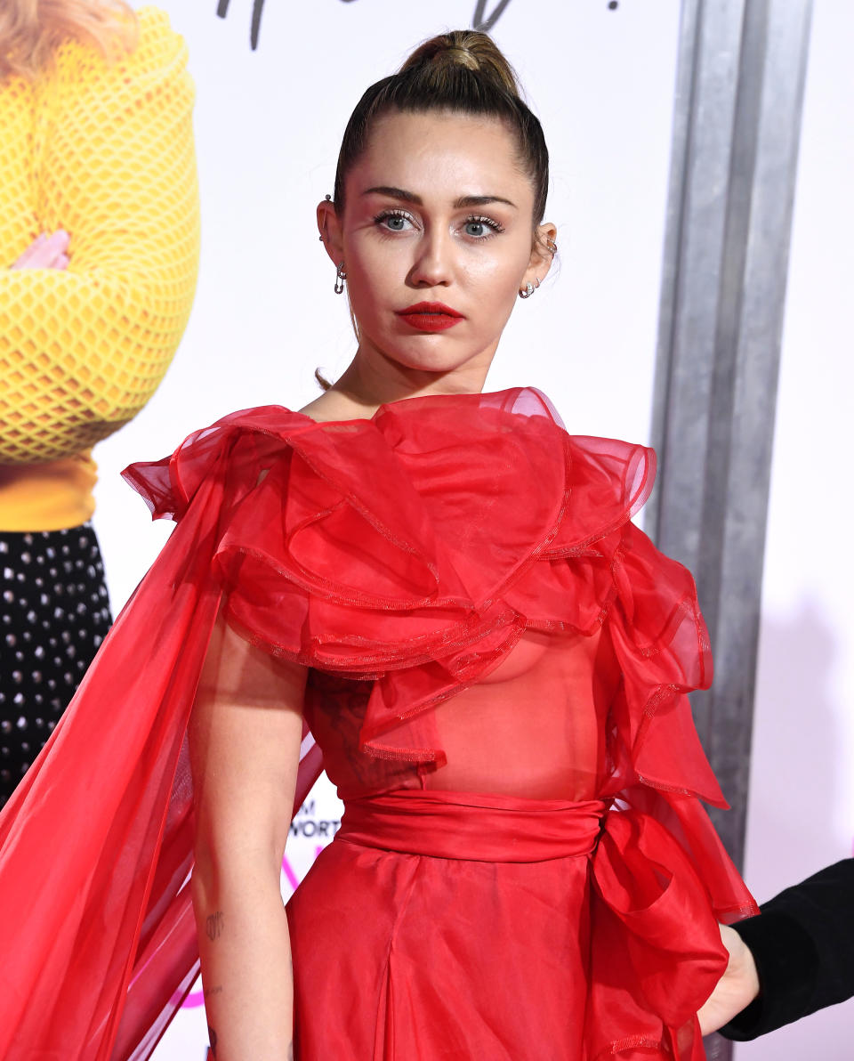 Close-up of Miley at a media event