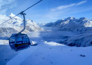 An empty gondola goes up in Zermatt, Switzerland, Thursday, Dec.3, 2020. Zermatt is home to one of the Swiss ski stations that has become an epicenter of discord among Alpine neighbors. EU member states Austria, France, Germany and Italy are shutting or severely restricting access to the slopes this holiday season amid COVID-19 concerns, Switzerland is not. (AP Photo/Jamey Keaten)