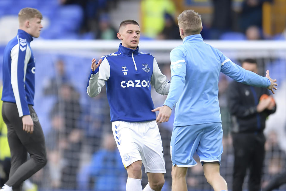 Vitalii Mykolenko (pictured left) and Oleksandr Zinchenko (pictured right) embrace before a Premier League match.