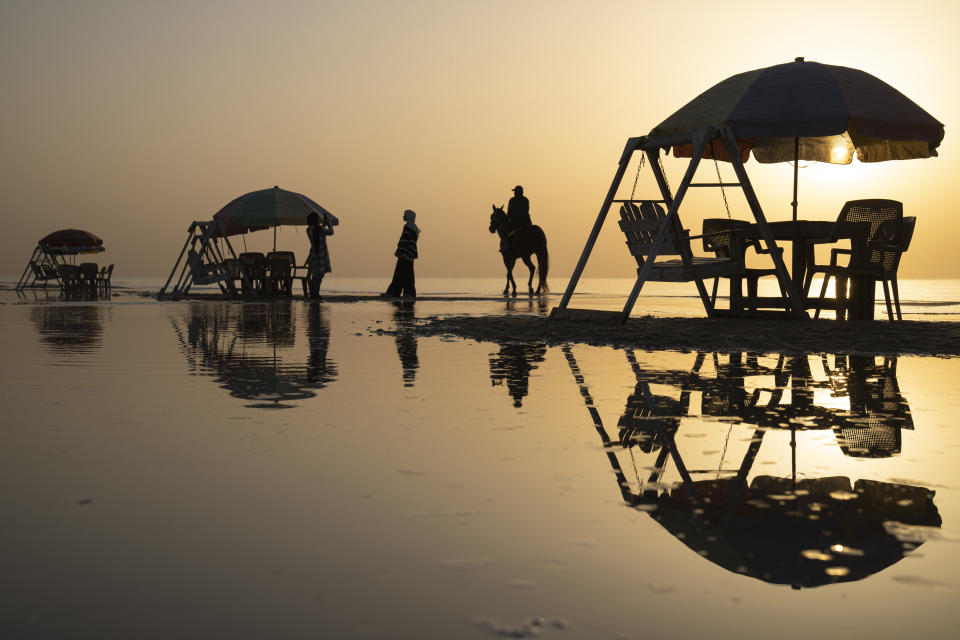 Palestinians enjoy the day on the beach during hot weather in Gaza City, Tuesday, Feb. 28, 2023. (AP Photo/Fatima Shbair)