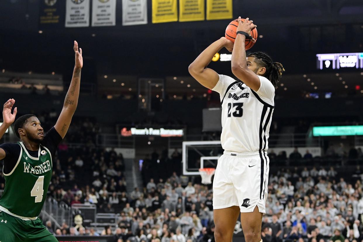 Nov 28, 2023; Providence, Rhode Island, USA; Providence Friars forward Bryce Hopkins (23) shoots over Wagner Seahawks forward Tyje Kelton (4) during the first half at Amica Mutual Pavilion. Mandatory Credit: Eric Canha-USA TODAY Sports