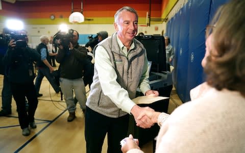 Republican candidate for Virginia governor Ed Gillespie shakes hands with a poll worker after casting his vote in the gymnasium at Washington Mill Elementary School November 7, 2017 in Alexandria, Virginia - Credit: Getty