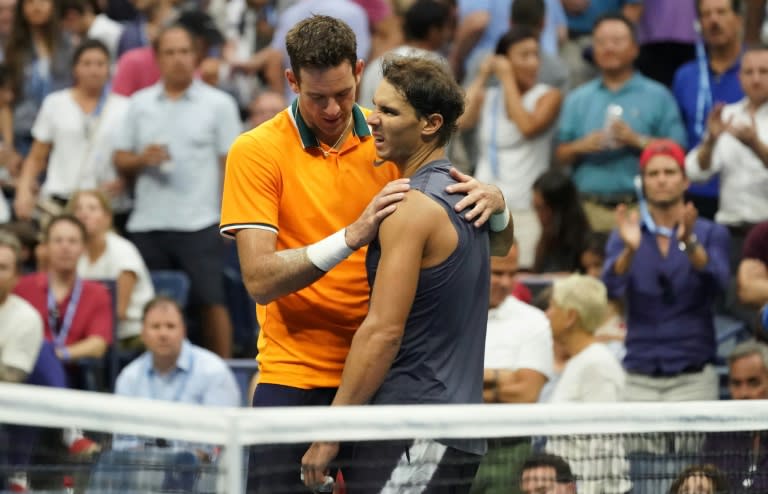 It's over: Rafael Nadal is consoled by Juan Martin del Potro