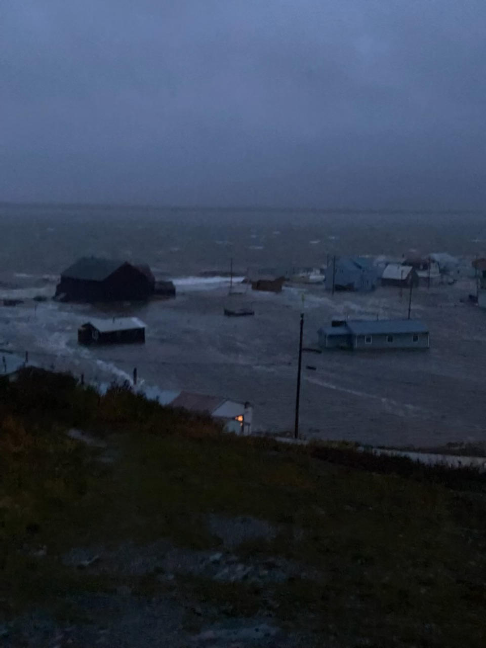 This photo provided by Clarabelle Lewis shows flooding early Saturday morning, Sept. 17, 2022, in Golovin, Alaska. Much of Alaska's western coast could see flooding and high winds as the remnants of Typhoon Merbok moved into the Bering Sea region. The National Weather Service says some locations could experience the worst coastal flooding in 50 years. (Clarabelle Lewis via AP)