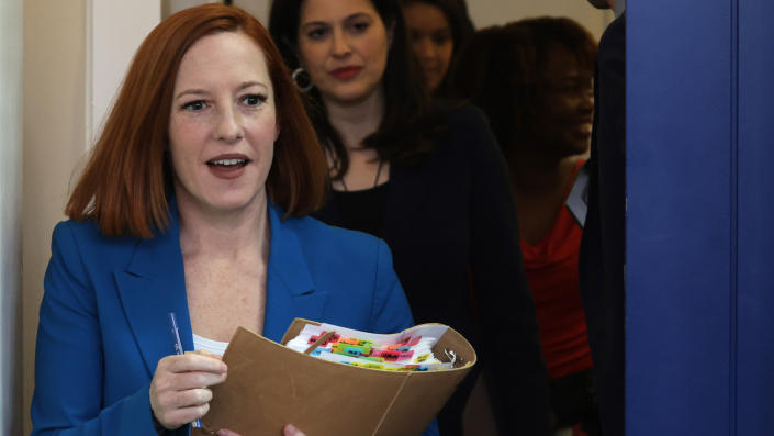 White House press secretary Jen Psaki arrives for a briefing with reporters. 