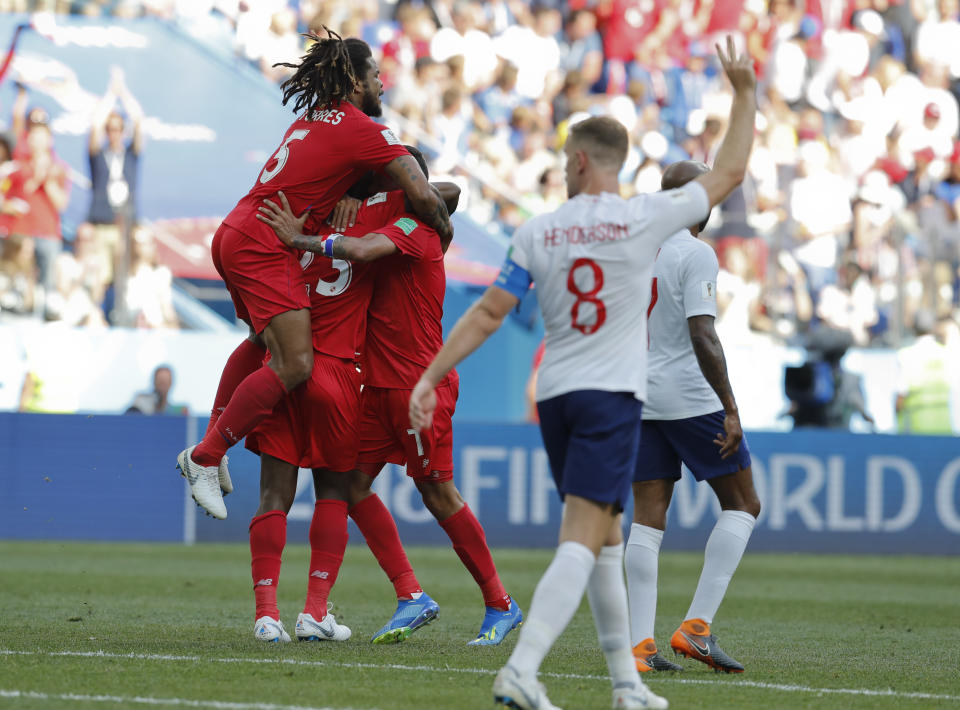 Panama players celebrate after Felipe Baloy scored the first goal at the World Cup in the nation’s history. (AP Photo)