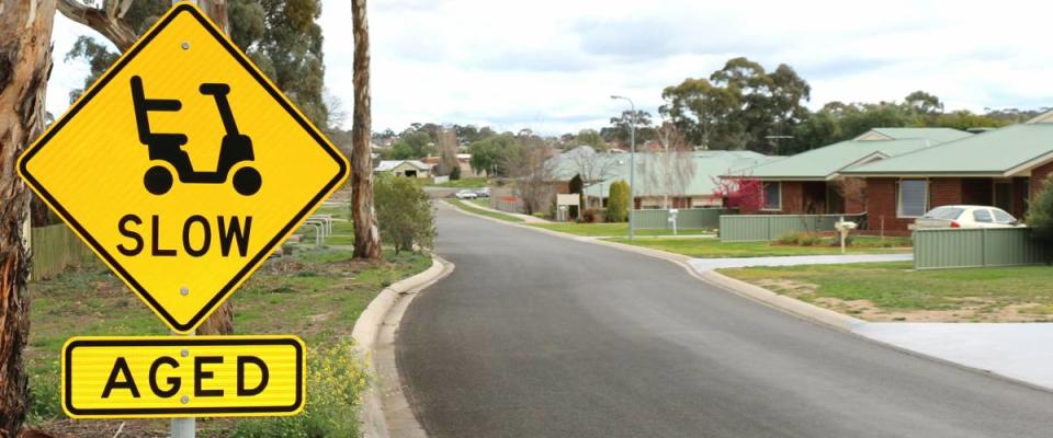 Slow and aged signs at the entrance of a retirement village