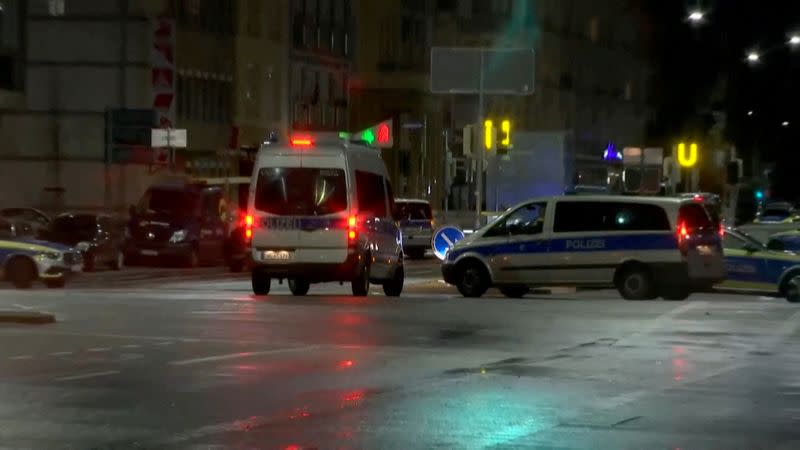 German police vehicles are seen as an unidentified person took people hostage inside a pharmacy in Karlsruhe