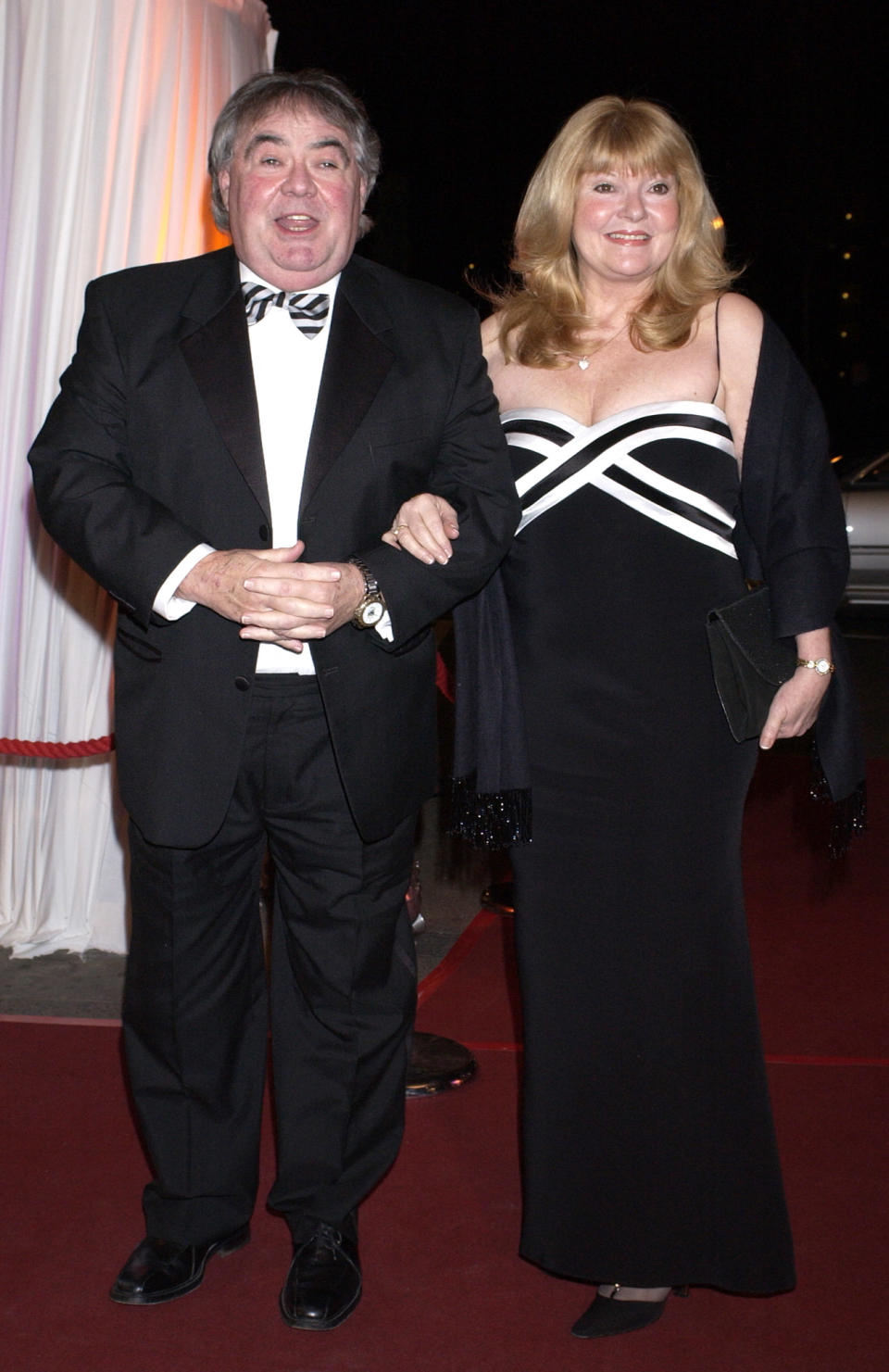 Eddie Large and wife Patsy arrive for the Bob Monkhouse BAFTA Tribute at BBC Television Centre in west London.   (Photo by Yui Mok - PA Images/PA Images via Getty Images)