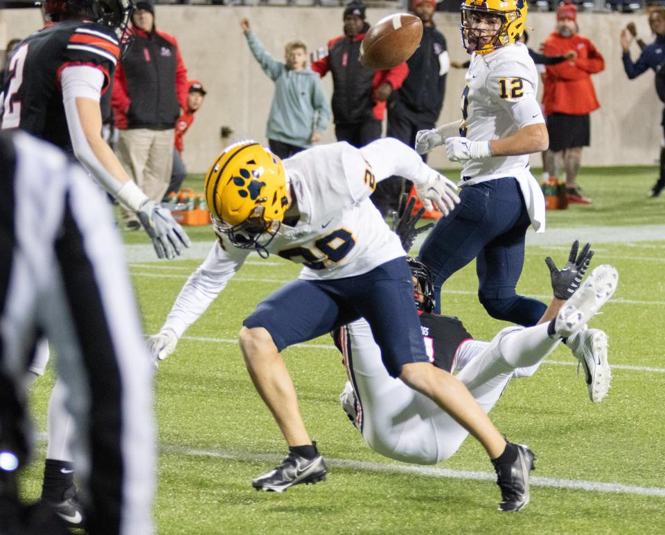 A hit by a St. Ignatius defender causes McKinley’s Keith Quincy to lose the ball near the goal line. McKinley’s Alex Vazquez ((2) recovers the ball in the end zone for the game-winning touchdown, Friday, Nov. 3, 2023.