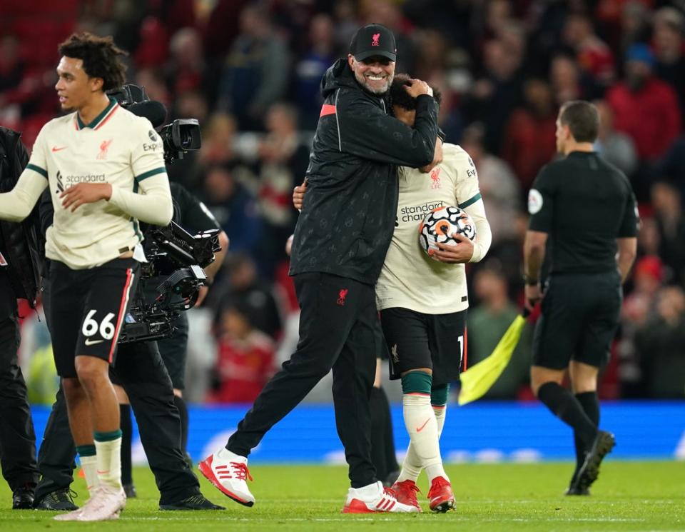 Liverpool manager Jurgen Klopp embraces hat-trick scorer Mohamed Salah after his side’s 5-0 win over Manchester United (Martin Rickett/PA) (PA Wire)