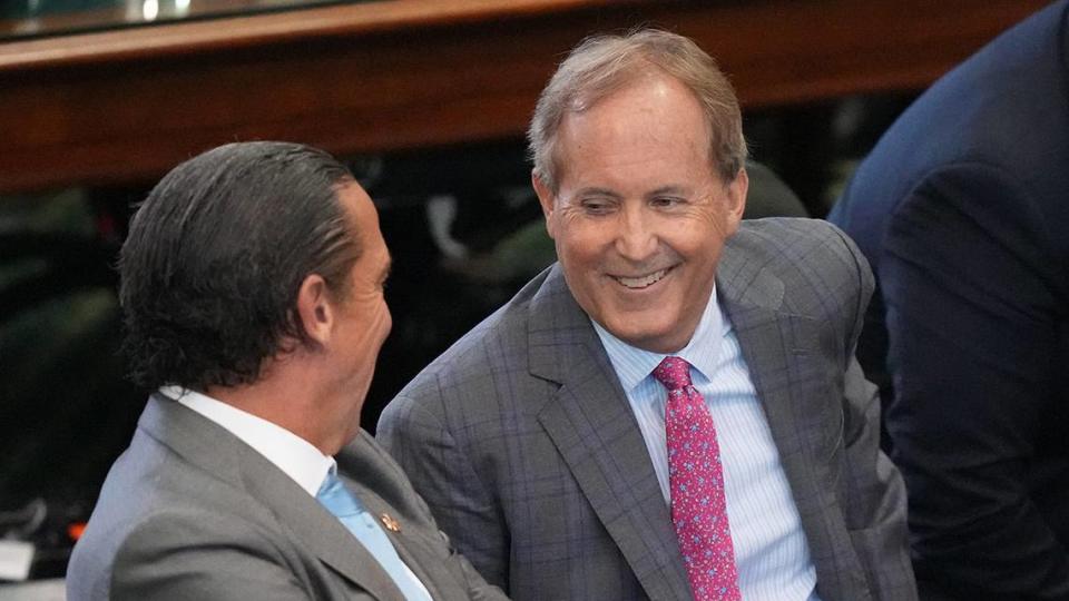 Attorney General Ken Paxton, middle, waits with his attorneys Tony Buzbee, left, and Mitch Little for closing arguments to begin at his impeachment trial at the Capitol on Friday September 15, 2023.
