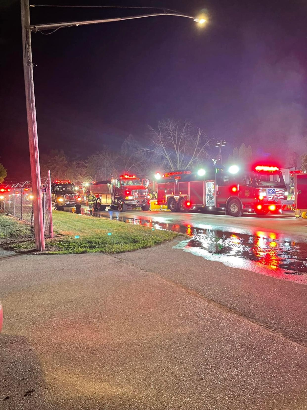 Fire trucks from numerous departments line up along the road outside Kral Scrap Metal in Big Bend, which was heavily damaged in a blaze on Sunday, July 10. Firefighters said the main building was fully engulfed by flames at one point.