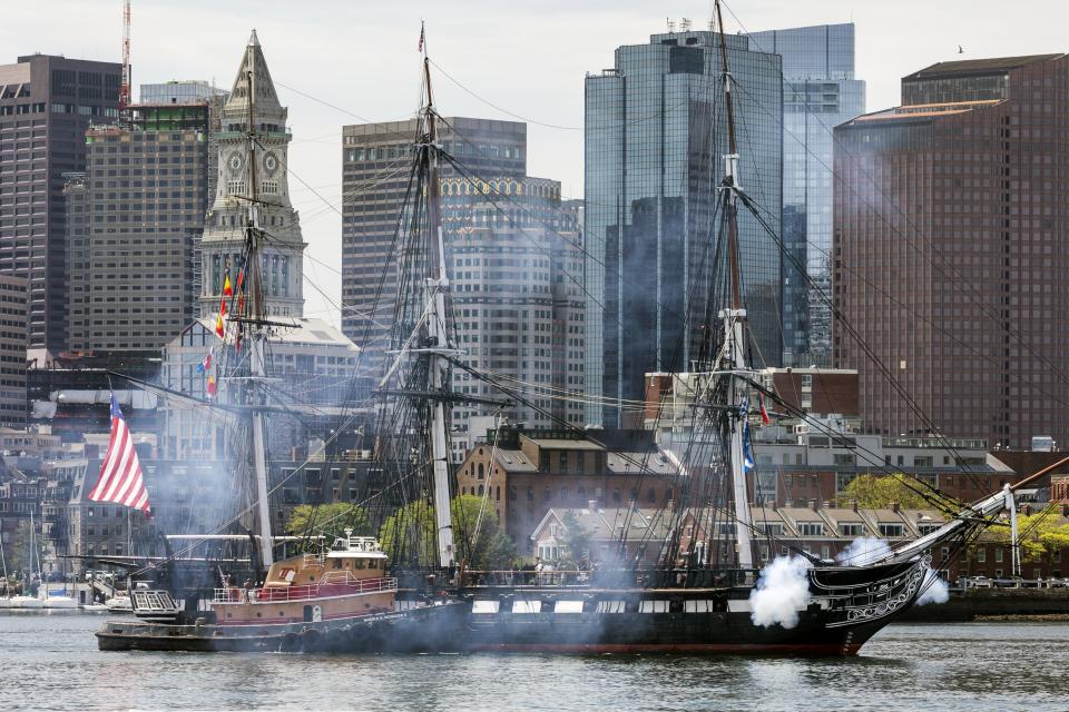USS Constitution fires her canons while underway, Friday, May 21, 2021, in Boston. The ship will reopen to the public on Friday and celebrated with her first underway in more than a year due to COVID-19 pandemic. (AP Photo/Michael Dwyer)
