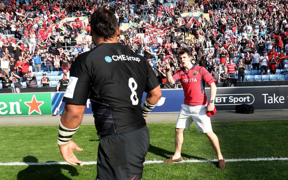 Saracens' Billy Vunipola is confronted by a fan in a Munster shirt  - REX