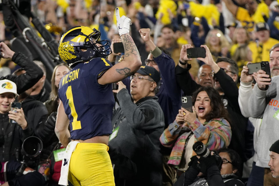 Michigan wide receiver Roman Wilson (1) celebrates after scoring a touchdown during the second half in the Rose Bowl CFP NCAA semifinal college football game against Alabama, Monday, Jan. 1, 2024, in Pasadena, Calif. (AP Photo/Mark J. Terrill)