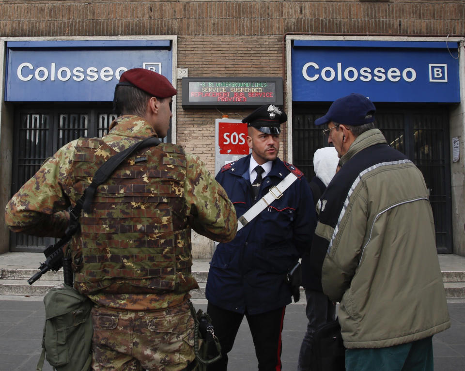 A man ask officers for information after the Colosseo subway station was closed following three earthquakes which hit central Italy in the space of an hour, shaking the same region that suffered a series of deadly quakes last year, in Rome, Wednesday, Jan. 18, 2017. There were no immediate reports of casualties but tremors were felt as far away as Rome, where the subway was closed as a precaution and parents were asked to pick up their children early from schools. (AP Photo/Domenico Stinellis)