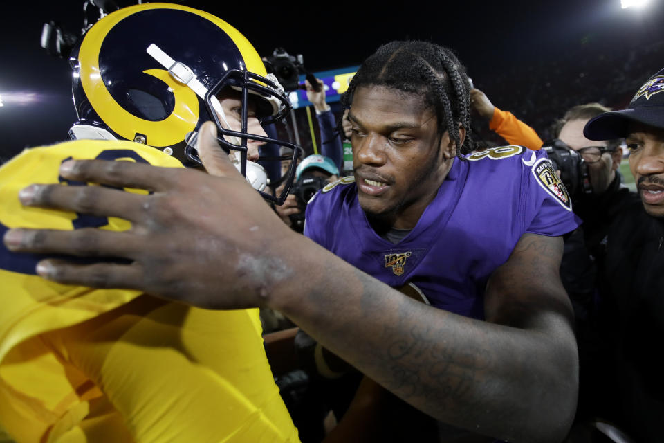 Baltimore Ravens quarterback Lamar Jackson hugs Los Angeles Rams quarterback Jared Goff after an NFL football game Monday, Nov. 25, 2019, in Los Angeles. (AP Photo/Marcio Jose Sanchez)