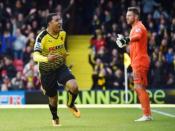 Britain Football Soccer - Watford v Aston Villa - Barclays Premier League - Vicarage Road - 30/4/16 Troy Deeney celebrates after scoring the second goal for Watford as Aston Villa's Mark Bunn looks on dejected Reuters / Toby Melville Livepic