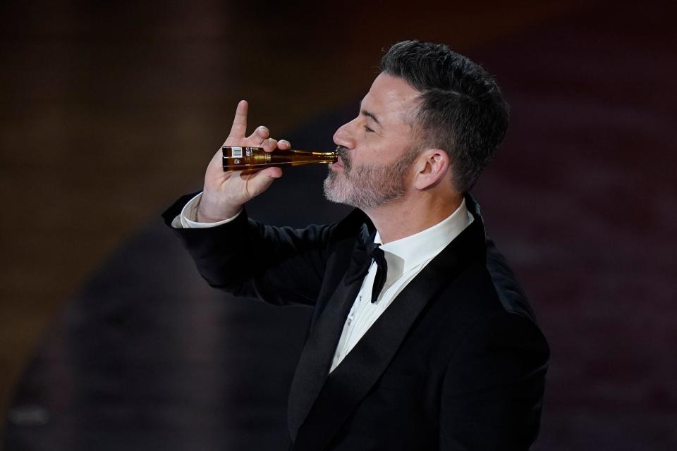 Jimmy Kimmel drinks a miniature bottle of tequila Don Julio 1942 during the 96th Oscars at the Dolby Theatre at Ovation Hollywood in Los Angeles on March 10, 2024.