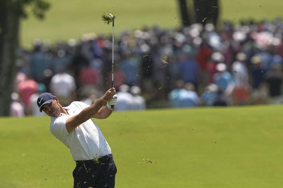 Brooks Koepka hits from the rough on the first hole during the first round of the PGA Championship.