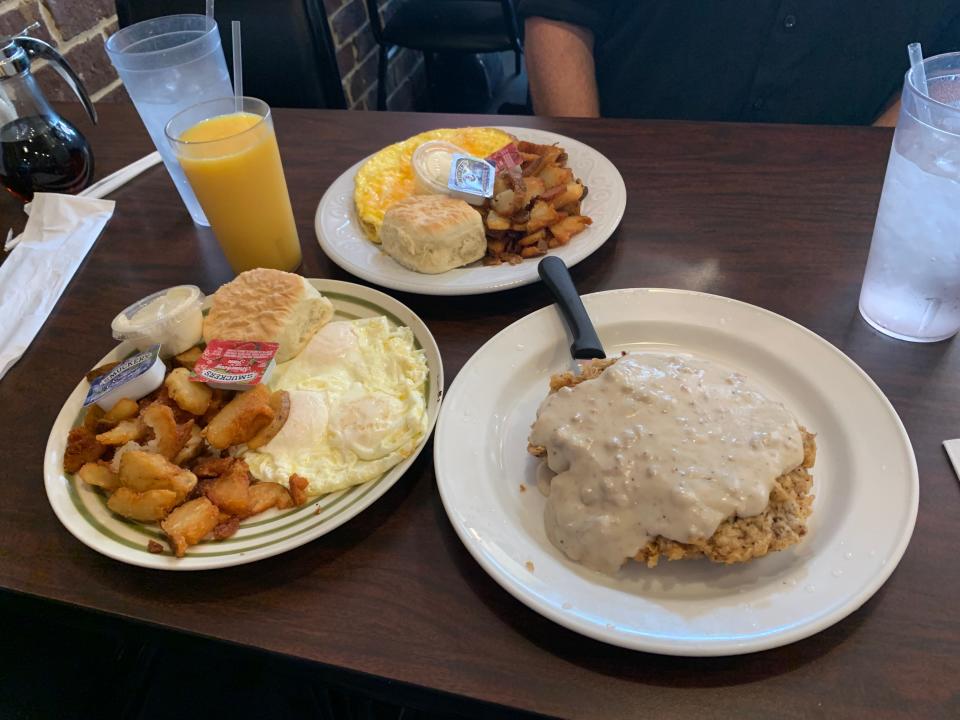 The slight darkness of the cream gravy on the chicken fried steak at Dolli's Diner in Nacogdoches predicted the full taste of a busy grill.