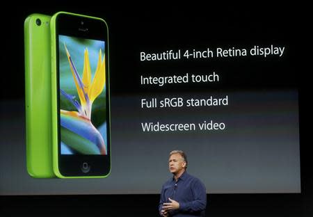 Phil Schiller, senior vice president of worldwide marketing for Apple Inc, talks about the features of the new iPhone 5C at Apple Inc's media event in Cupertino, California September 10, 2013. REUTERS/Stephen Lam