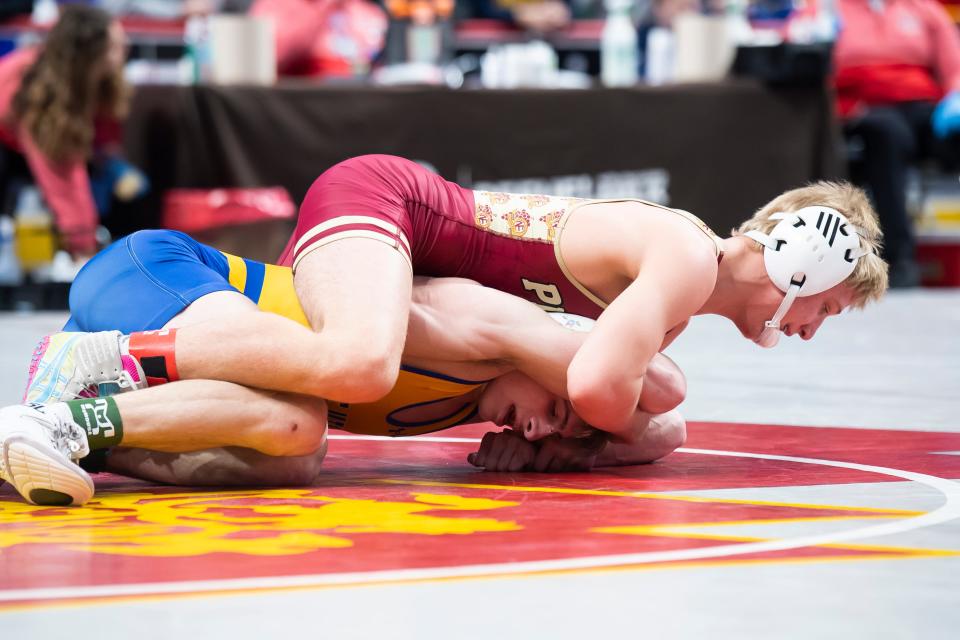 North East's Cyrus Hurd (top) wrestles Line Mountain's Nolan Baumert in a 127-pound first round bout at the PIAA Class 2A Wrestling Championships at the Giant Center on March 9, 2023, in Derry Township. Hurd won by decision, 7-1. 