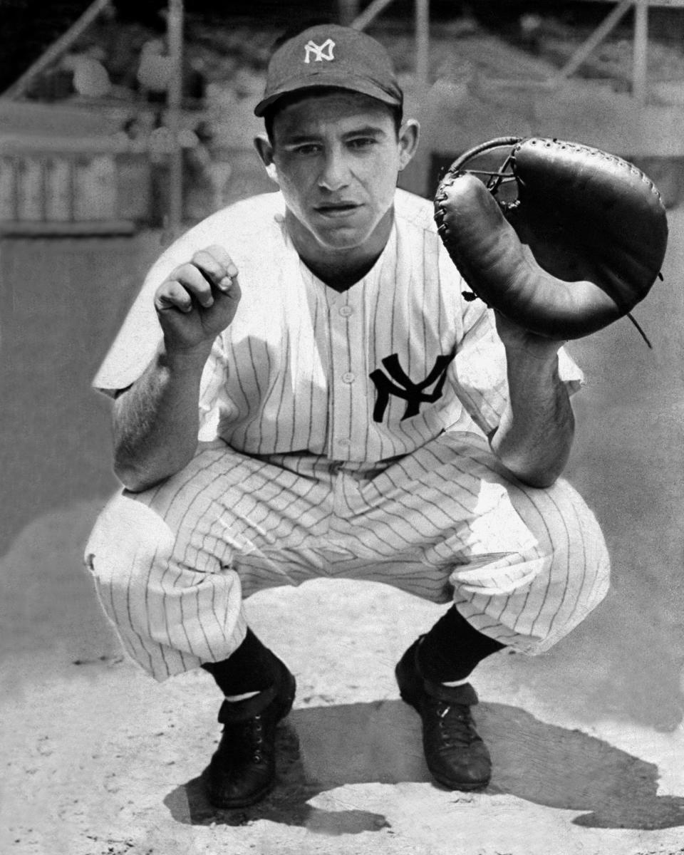 Lawrence Peter "Yogi" Berra caught on with the Yankees in the late 1940s and help joe DiMaggio close out his career with three straight world titles. In all, Berra played on 10 Yankee championship teams.