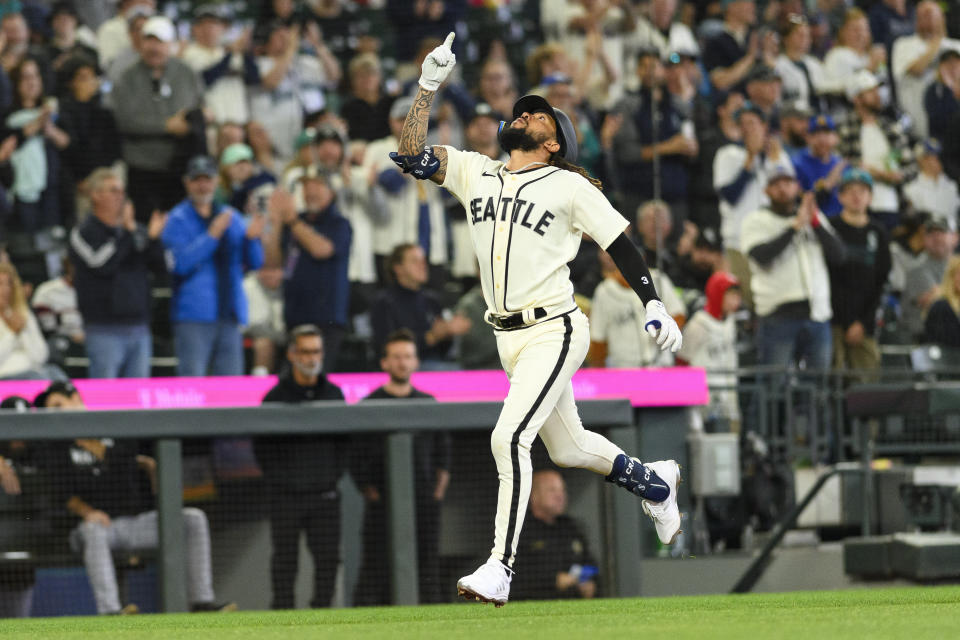 Seattle Mariners' J.P. Crawford gestures as he rounds the bases after hitting a solo home run against the Chicago White Sox during the first inning of a baseball game, Saturday, June 17, 2023, in Seattle. (AP Photo/Caean Couto)
