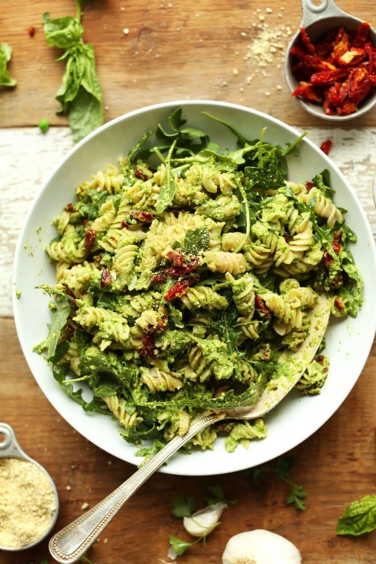 <strong>Get the <a href="https://minimalistbaker.com/pea-pesto-pasta-with-sun-dried-tomatoes-arugula-vegan-gf/" target="_blank">Pea Pesto Pasta with Sun-Dried Tomatoes and Arugula recipe</a> from Minimalist Baker</strong>