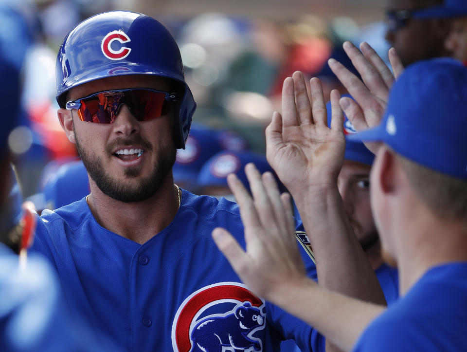 You’ll get high-5s after a Kris Bryant selection. (AP/Matt York)